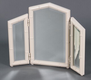 A triple bevelled plate dressing table mirror contained in a white painted faux bamboo frame 56cm x 68cm 