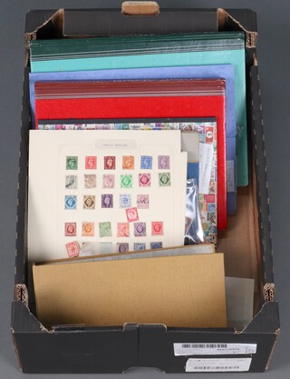 Six stock book of GB mint and used stamps, George VI to Elizabeth II, an album of first day covers and other stamps, contained in a fruit box 