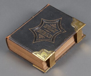 The Illustrated National Family Bible, leather bound and with brass mounts 