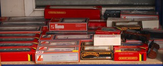 A collection of Hornby and Lima OO gauge carriages and rolling stock 