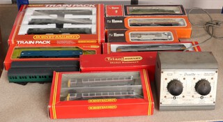 A Hornby OO gauge R451 BR Pacer Twin Rail Bus, a Hornby R369 Train Pack, a Hornby R288 CO-CO Diesel, a Triang R715 CO-CO Type 3 Diesel boxed, a Triang R357 Diesel boxed, 3 Lima diesels and a Duette power supply unit