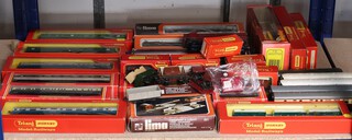 A quantity of Triang, Hornby and Lima carriages and rolling stock 