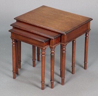 A nest of 3 mahogany coffee tables on turned supports 47cm h x 52cm w x 40cm d 