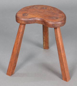 An elm kidney shaped 3 legged stool on outswept supports 38cm h x 31cm w x 22cm d 