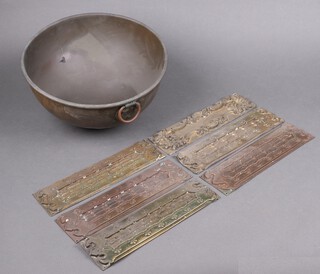 A circular copper pot 32cm diam. together with 6 embossed metal finger plates 