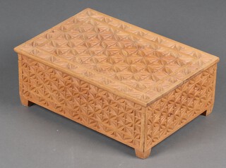 A rectangular Eastern carved hardwood box with hinged lid and fitted interior 17cm h x 45cm w x 31cm d (split to lid)