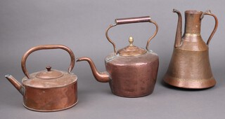 An Eastern copper kettle 30cm, a circular copper kettle 20cm and 1 other with acorn finial 20cm 