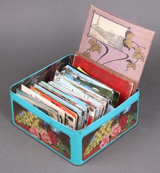 An album of Players Cigarette cards and a collection of postcards