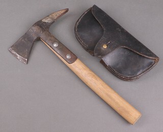 A Second World War ARP fire axe in a leather frog marked ARP 1939 