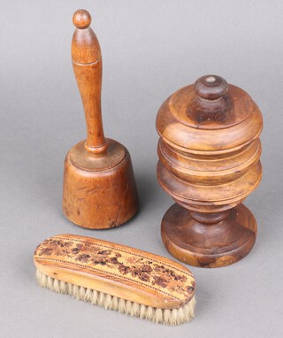 A rectangular clothes brush with Tunbridge Ware decoration 17cm, a turned lignum vitae urn and cover 18cm and a turned wooded mull 