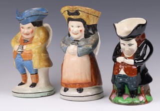 Two 19th Century Staffordshire pottery Toby jugs - Toby Philpots 22cm (chip to hat), Mrs Philpots and 1 other Toby Philpots 20cm 