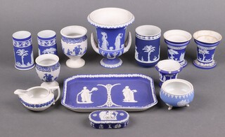 A Wedgwood blue Jasperware urn of campanula form 15cm, a rectangular dressing table tray and other miniature Wedgwood items 