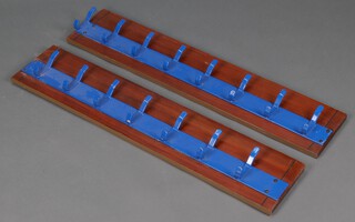 Two metal, blue painted 7 hook coat racks on mahogany mountings 23cm h x 107cm w  