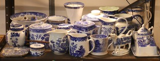A Ringtons Ltd. Willow pattern blue and white teapot, a biscuit barrel and cover and a collection of decorative blue and white decorated china 