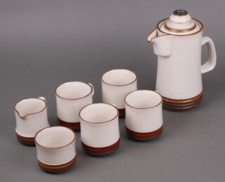 A Denby 7 piece coffee service, base marked Denby England 84 comprising coffee pot, 4 coffee mugs, sugar bowl and cream jug 