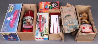 A Chinese Mystery Action model bus, a Chinese battery operated model "Photoing on Car boxed, a Charley Weaver 1962 battery operated bar tender boxed (box damaged) and a pocket "Simon" game 