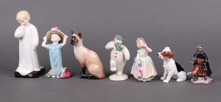 Seven Royal Doulton figures - Darling HN1319, Make Believe HN2225, Siamese Cat, The Snow Man DS2, Babie, King Wenceslas HN3262 and seated Terrier with bone 