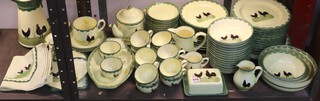 A Zeller Fayencerie German pottery 84 piece dinner/tea service comprising circular platter, 11 dinner plates, 12 side plates, 13 dessert bowls, 3 graduated bowls, butter dish and cover, large jug, small jug, cream jug, 14 cups, 14 saucers, tea pot, spoon rest, breakfast cup and 2 saucers, twin handled dish, heart shaped dish, jar and cover, 2 circular dishes, Thermos jug and tea towel  (8 dinner plates, 1 side plate, 8 dessert bowls, 2 saucers and 2 cups all ring flat) 