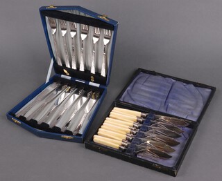 Two cased sets of 6 silver plated fish knives and forks 