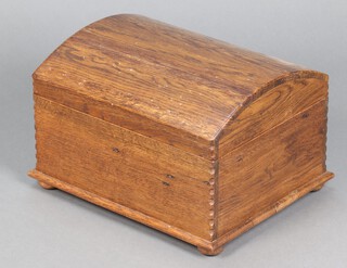 A domed oak trinket box with hinged lid 27cm h x 46cm w x 37cm d 