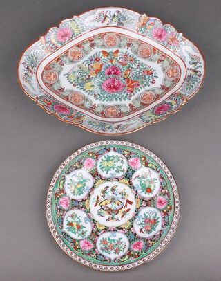 A 20th Century Cantonese dish with floral and butterfly decoration 6.5cm h x 35cm w, together with a 20th Century Cantonese plate 23cm diam. 