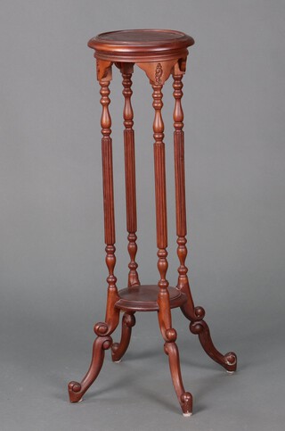 A Victorian style circular mahogany 2 tier jardiniere stand on cabriole supports 99cm h x 30cm diam. 