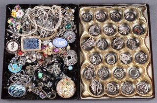 A collection of silver earrings and items of costume jewellery including Crown Staffordshire and Wedgwood brooches, necklaces, etc contained in 2 shallow trays 