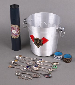 A Bollinger aluminium wine cooler together with a kaleidoscope - The Optical Fragments of The Isle of Wight , 2 cloisonne enamelled napkin rings and various souvenir spoons