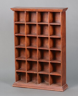A hardwood range of 24 pigeon holes with moulded cornice, on a shaped platform base 89cm h x 68cm w x 18cm d 