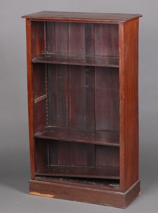 A Victorian mahogany adjustable bookcase, fitted shelves, on a platform base 122cm h x 71cm w x 30cm d (veneer missing to the base) 
