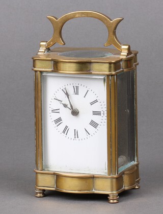 A 19th Century carriage timepiece with 5cm dial contained in a shaped gilt metal case 11cm x 9cm x 7cm  (not running and without a key) 