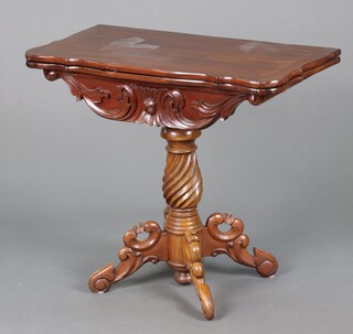 A Victorian style hardwood tea table with carved apron, raised on a spiral turned column with cabriole supports 75cm h x 84cm w x 41cm d (water and contact marks in places and damage to interior) 