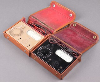 Two Bakelite Avo Multiminor Mk4 meters contained in brown leather case