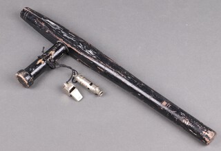 An ebonised wooden night stick together with 2 whistles