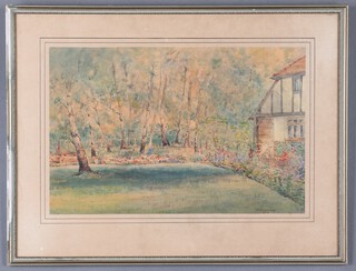 G A Edwards, watercolour, cottage garden with building, signed and dated 1953, 24cm x 36cm 