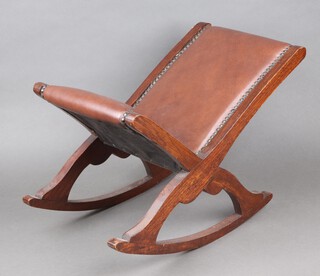 A Victorian oak framed rocking gout stool upholstered in brown material 37cm h x 46cm w x 30cm d