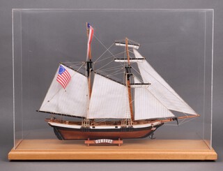 A 2 masted model of an American sailing ship "Newport" contained in a perspex and wooden case 46cm x 63cm x 20cm 