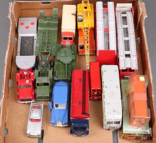 A Dinky 219 Atlantean City Bus, Dinky Super Toys Foden Tanker, a 660 Tank Transporter, a 651 Centurion tank and other Dinky Toys contained in a fruit tray 