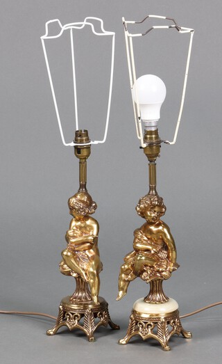 A pair of gilt metal table lamps decorated cherubs 38cm 