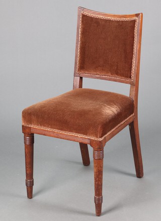 A 19th Century mahogany show frame dining chair with upholstered seat and back raised on turned supports