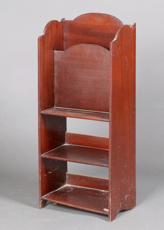 A Liberty style stepped mahogany bookcase incorporating a magazine rack 79cm h x 33cm w x 19cm d 