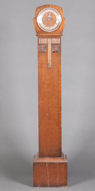 A 1930's chiming granddaughter clock contained in an oak case 139cm h 