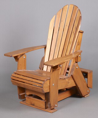 An "Adirondack" slatted hardwood rocking garden chair 114cm h 92cm x 74cm 