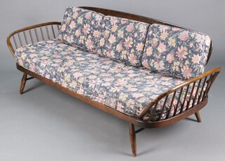 An Ercol dark elm and beech bar back framed sofa  (contact marks in places) 78cm h x 209cm w x 75cm d 