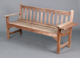 A wooden slatted garden bench 81cm h x 159cm w x 56cm d 