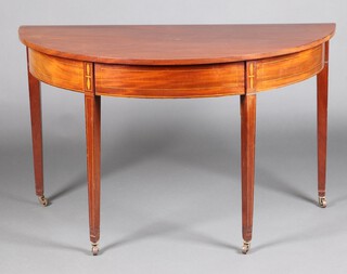 A 19th Century inlaid mahogany demi-lune table, raised on 4 square tapered supports with casters 74cm h x 123cm w x 61cm d 