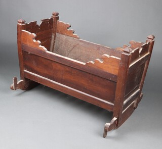 An 18th/19th Century fruitwood rocking cradle, the head carved "Thou shalt lie down and thy sleep shall be sweet" 62cm h x 91cm w x 65cm d 
