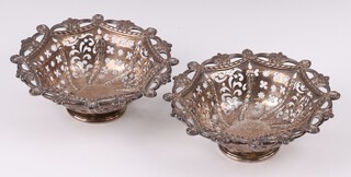 A pair of Victorian pierced silver bowls, London 1873 by George Angell & Co., bases engraved, 186 grams 