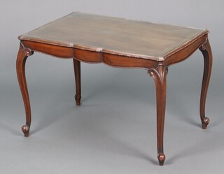 An Edwardian mahogany coffee table of serpentine outline with inset plate glass top, raised on cabriole supports 51cm h x 75cm w x 51cm d 
