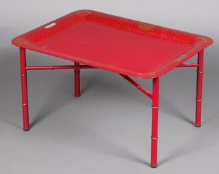A rectangular red and gilt painted metal Regency style toleware tray and stand with X framed stretcher 42cm h x 75cm w x 56cm d 